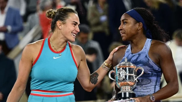 US’ Coco Gauff holds the French Open trophy as she poses on the podium with Belarus' Aryna Sabalenka at the end of the final on Court Philippe-Chatrier at Roland-Garros Complex in Paris earlier this m