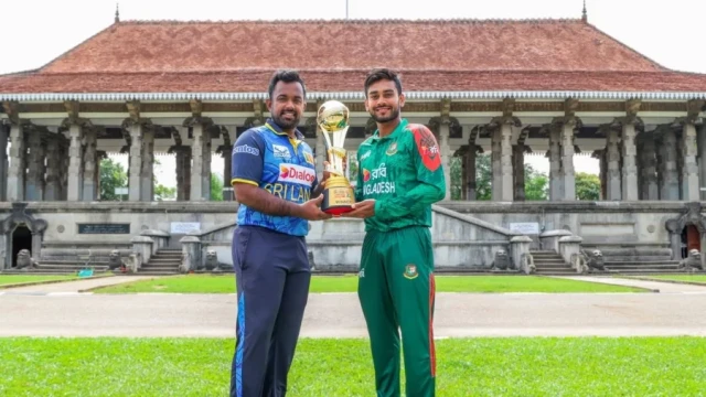 Bangladesh captain Mehedi Hasan Miraz and his Sri Lankan counterpart Charith Asalanka pose with the One Day International series trophy in Colombo Tuesday Photo: Sri Lanka Cricket